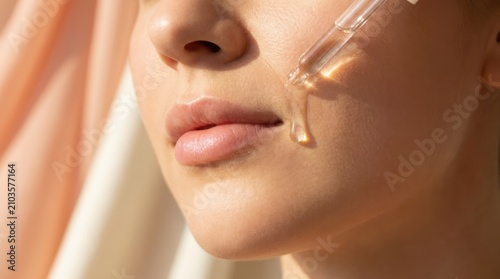 Close-up of Woman Applying Facial Oil