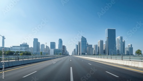 Contemporary city skyline under a bright blue sky and clear road.