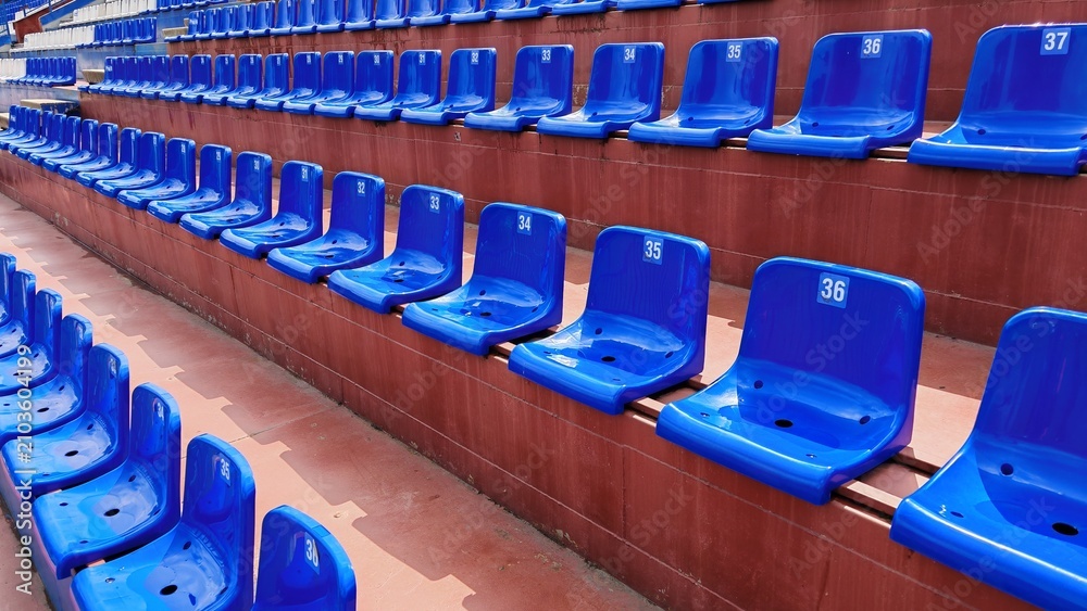 Fototapeta premium Blue stadium seats in a football arena
