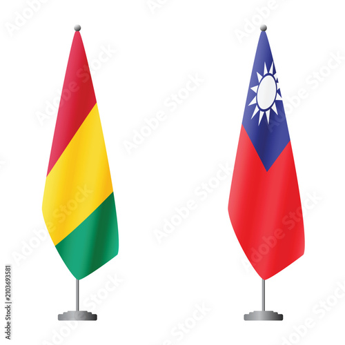 Foto Guinea and Taiwan flags on flagpoles for official ceremonies and meetings, trans