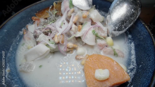 Mixing up a bowl of Peruvian ceviche
