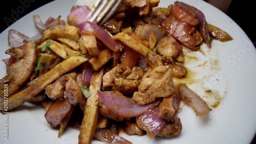A plate of Peruvian pollo saltado cuisine
