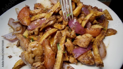 Picking up french fries from Pollo Saltado