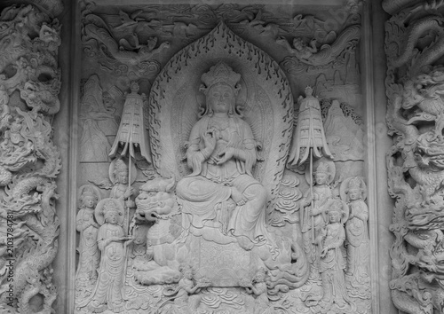 Bild auf Leinwand Bas-relief of Bodhisattva on the Wall of a Buddhist Monastery