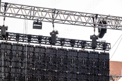 a temporary scaffolding structure built to support a large outdoor LED video wall, often used for concerts or events