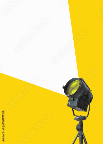 Flat design. Retro big stage light, searchlight with spot light - film camera. Vintage cinema poster with copy space.
