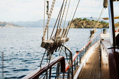View from Traditional Wooden Gulet Deck with Rigging and Island Horizon