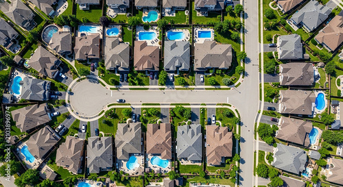 Aerial view of a modern residential neighborhood with houses and swimming pools