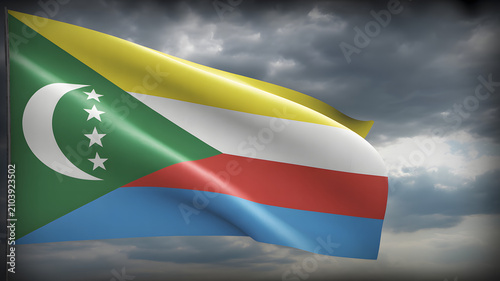 Comoros flag waving in stormy dark cloudy sky dramatic lighting national flag country flag Africa