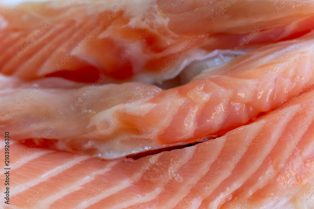 Fototapeta premium Fresh salmon fillets presenting healthy seafood choice for cooking Rich in protein ready for culinary preparation.