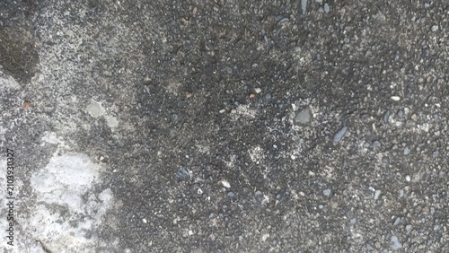 Fotografi Dark Concrete Texture featuring coarse weathered cement with stone aggregates, i
