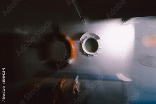 Orange life ring hanging inside the boat in motion blur effect