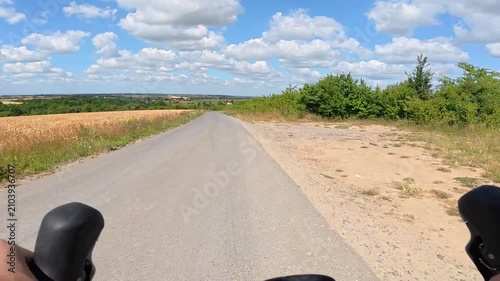 Gravel bicycle ride on the road in the summer season