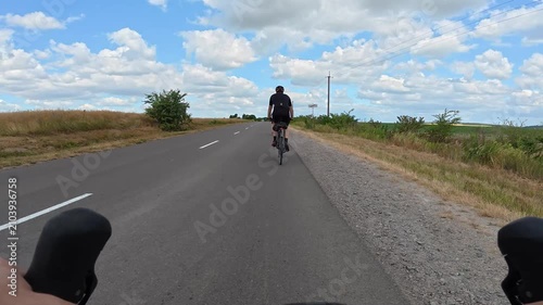Gravel bicycle ride on the road in the summer season