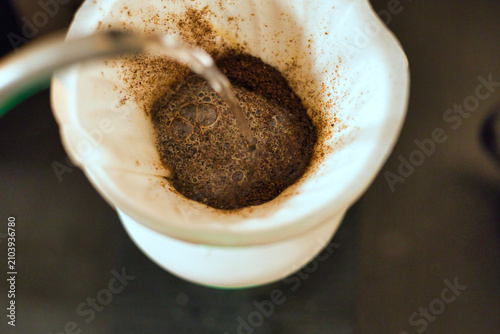Close-up of V60 drip coffee brewing method with pour over