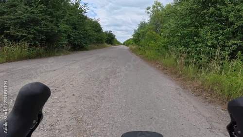 Gravel bicycle ride on the road in the summer season