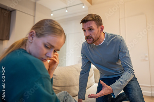 Принти на полотні Aggressive manipulative husband accuses wife of infidelity and confronting woman during brawl, nervous hysterical man emotionally speaking with unhappy female partner, distrust and toxic jealousy