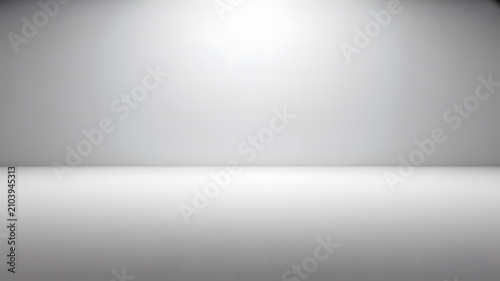 Empty white and gray studio backdrop with soft light and shadow