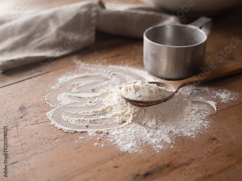 Spilled flour on a wooden table, pastries food, raw material