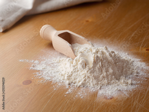 Spilled flour on a wooden table, pastries food, raw material