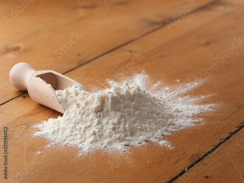 Spilled flour on a wooden table, pastries food, raw material