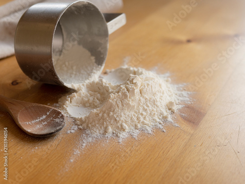 Spilled flour on a wooden table, pastries food, raw material