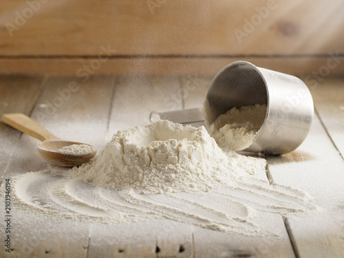 Spilled flour on a wooden table, pastries food, raw material