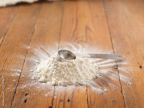 Spilled flour on a wooden table, pastries food, raw material