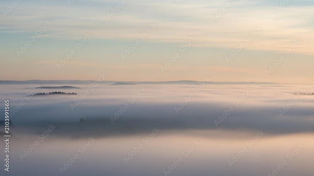 Obraz premium Serene coastal landscape with calm water and distant ship.