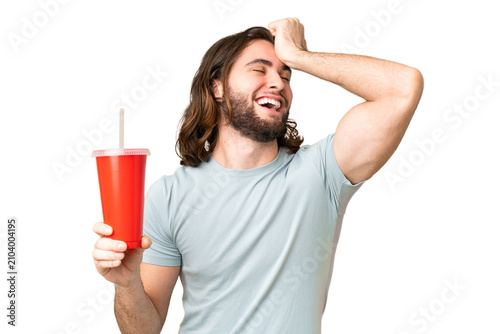 фотографія Young handsome man holding soda over isolated chroma key background has realized