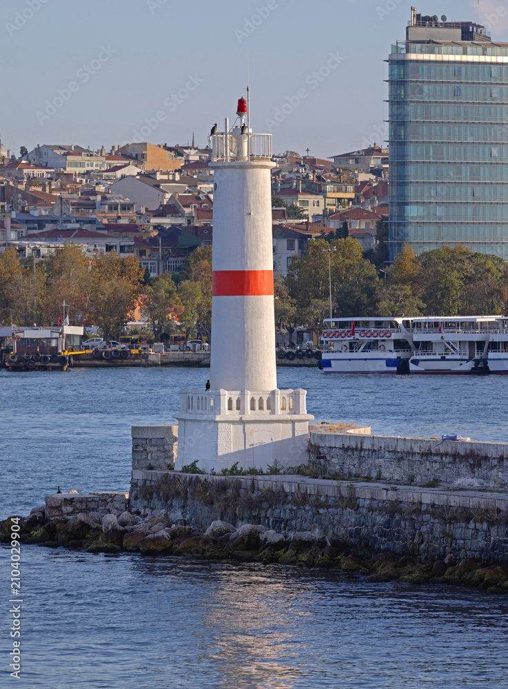 Fototapeta premium White Lighthouse With Red Line at Kadikoy Port in Istanbul Turkey Sunny Autumn Day