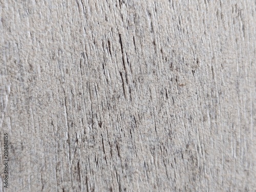A high-quality distressed wood texture featuring aged, weathered wooden planks with natural cracks, scratches, worn paint, and rustic grain details. This vintage wooden background is ideal for graphic