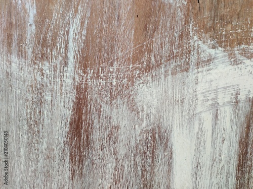 A high-quality distressed wood texture featuring aged, weathered wooden planks with natural cracks, scratches, worn paint, and rustic grain details. This vintage wooden background is ideal for graphic
