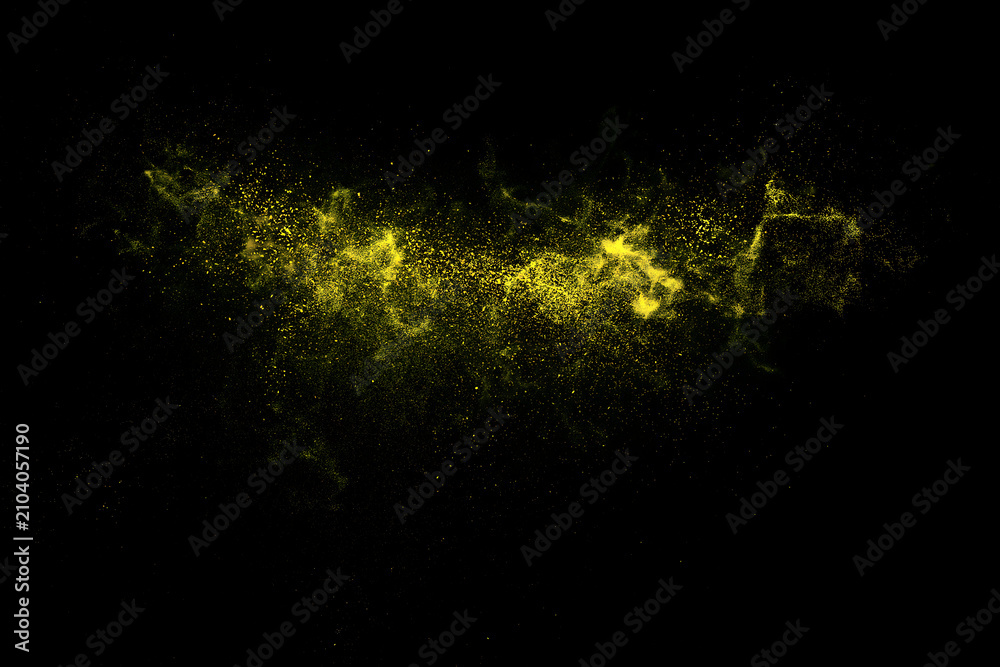 Fototapeta premium Yellow powder explosion against a black background a dynamic particle spray effect