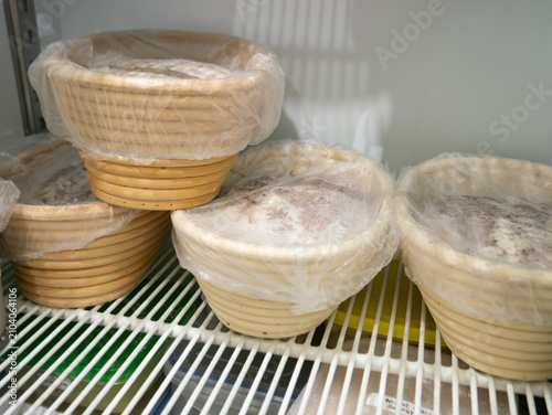 Bread Dough Proofing in Banneton Baskets Inside Refrigerator, Bakery Fermentation Process