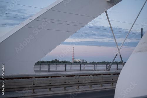 Bild auf Leinwand View from the Zezelj Bridge in Novi Sad with the thermal power plant in the dist