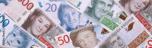 Swedish krona money bills pile on table. Sweden banknotes of SEK currency close up.
