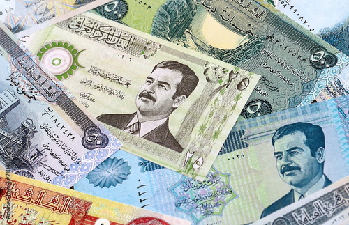 Cuadro en lienzo Iraqi dinar money bills pile on table