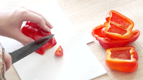 Slicing Red Bell Pepper into Strips During Food Preparation in Home Kitchen, 4K