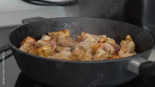 Slow Cooking Braised Meat in a Pan Close Up During Home Cooking Process, 4K