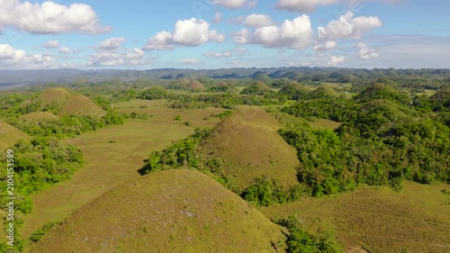Aerial view of Chocolate hills in Bohol island,Philippines. Hills covered with grass and vegetation.