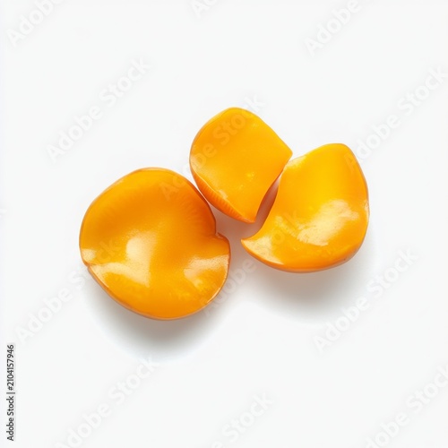 Close up Of Three Yellow Fruit Slices On A White Background