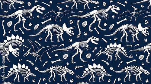 Seamless pattern of white dinosaur skeletons on dark background