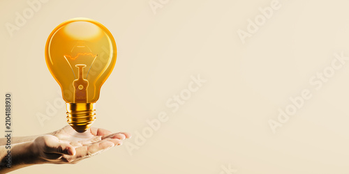Open hands presenting glowing orange light bulb on beige banner background wi...