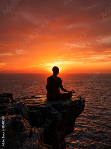 Wellness 3:4 banner, meditating silhouette on cliff at sunset, dramatic orange-crimson ocean sky, rim light edges, upper text space