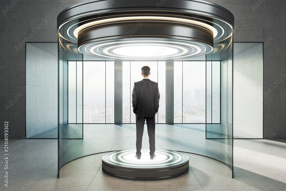 Obraz premium Businessman standing on illuminated round platform inside futuristic glass teleportation capsule in modern interior with panoramic city view window.