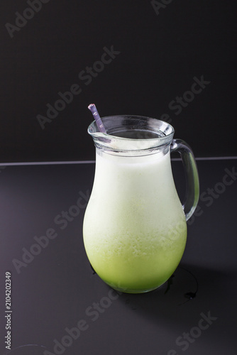 Refreshing rice wine makgeolli in a glass pitcher