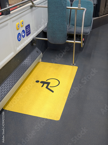 Space in a city passenger bus reserved for passengers with disabilities or baby strollers.