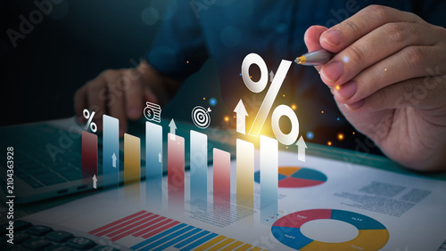 Trading increase revenue asset and profit icon concept. Business hand holding Chart stock market growth rate and growing arrow, analyzing investment diagram in business.