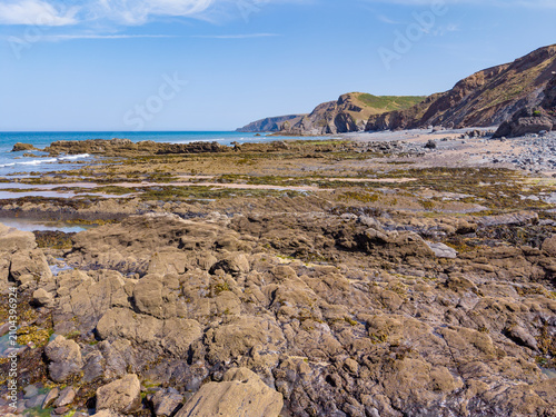 Ancient historic rock formations at the base of the Cornish cliffs